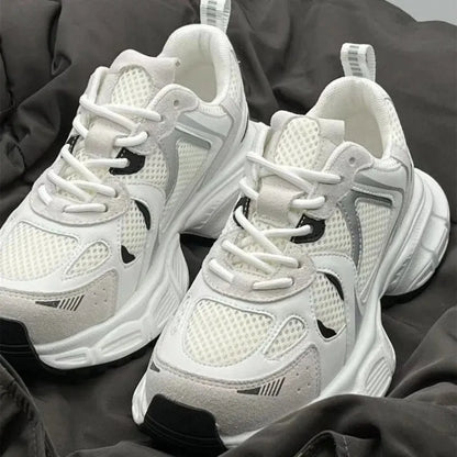 Beige Polar Wave mesh platform trainers with a wedge heel and lace-up front.