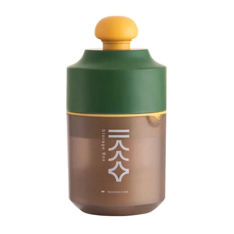 Green manual citrus juicer with lemon on counter, showing compact 180mm size.