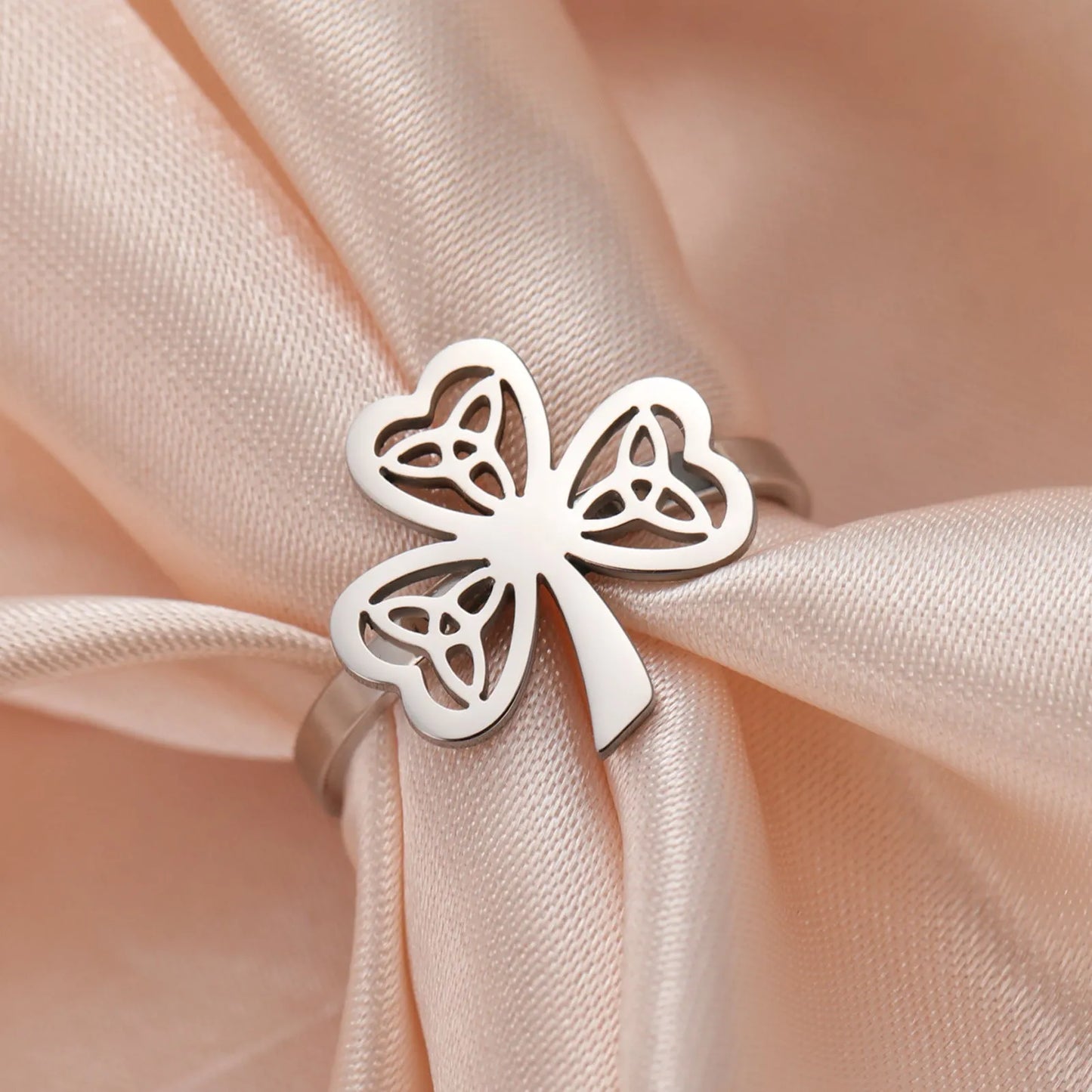 Stainless steel lucky ring with hollow band in gold or steel colour finish.