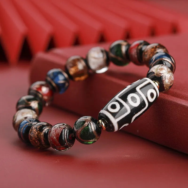 Colourful Chinese-style coloured glaze bracelet with auspicious patterns and snake symbol on beads.