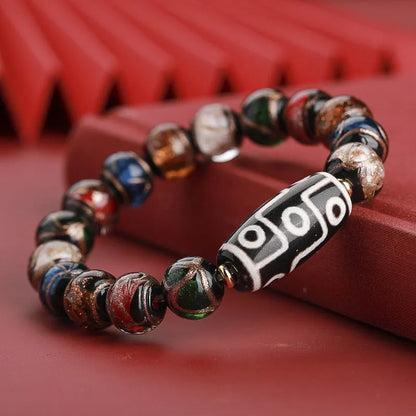Colourful Chinese-style coloured glaze bracelet with auspicious patterns and snake symbol on beads.