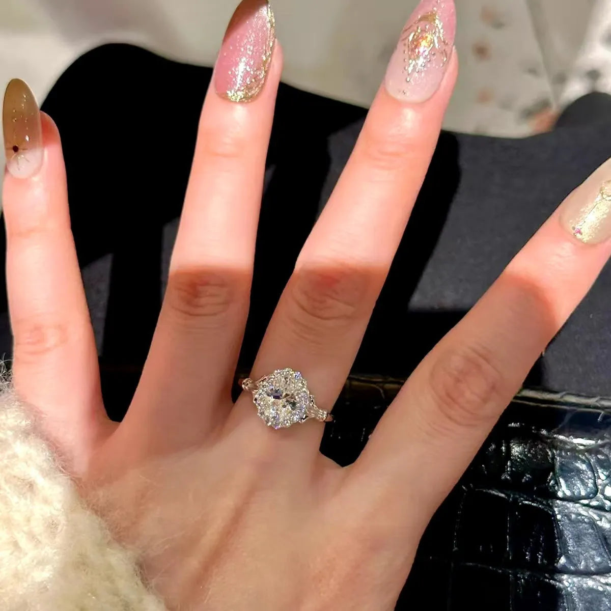 Silver colour geometric ellipse ring with adjustable opening and diamond-treated surface