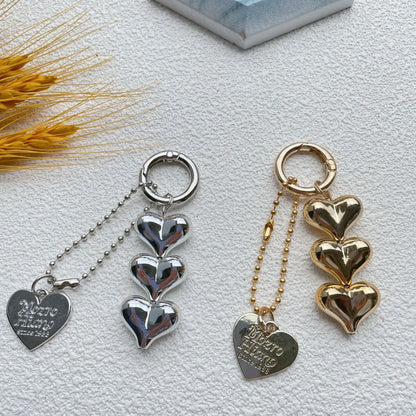 Acrylic key ring with an electroplated decorative charm in a choice of heart, bell, or water drop shapes.