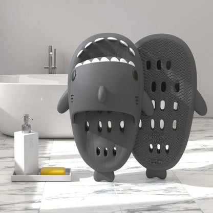 Colorful shark-themed shower slides with drainage holes, designed for comfortable and practical use in the pool or shower.