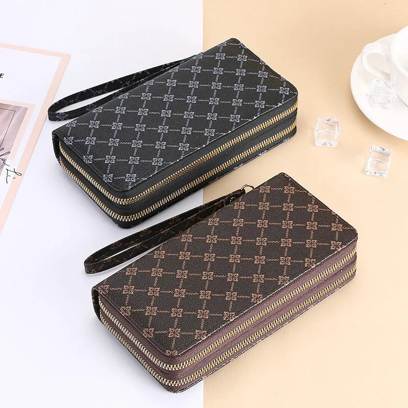 Long black retro-style PU leather wallet clutch with a printed pattern, showing a mobile phone pocket and a zippered coin purse.