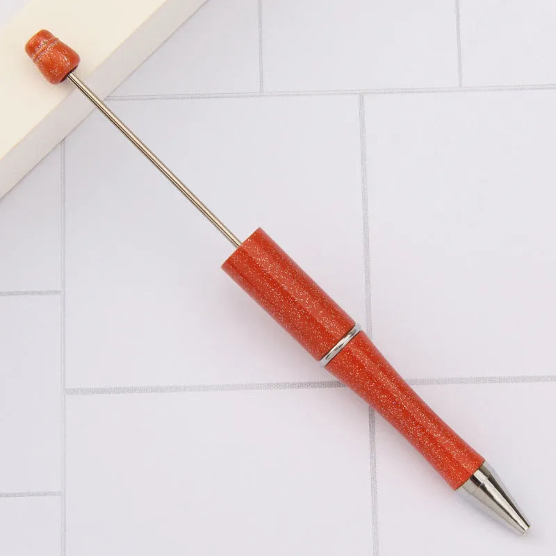 Rotating bead ballpoint pen in gradient colour with ABS plastic and steel wire construction