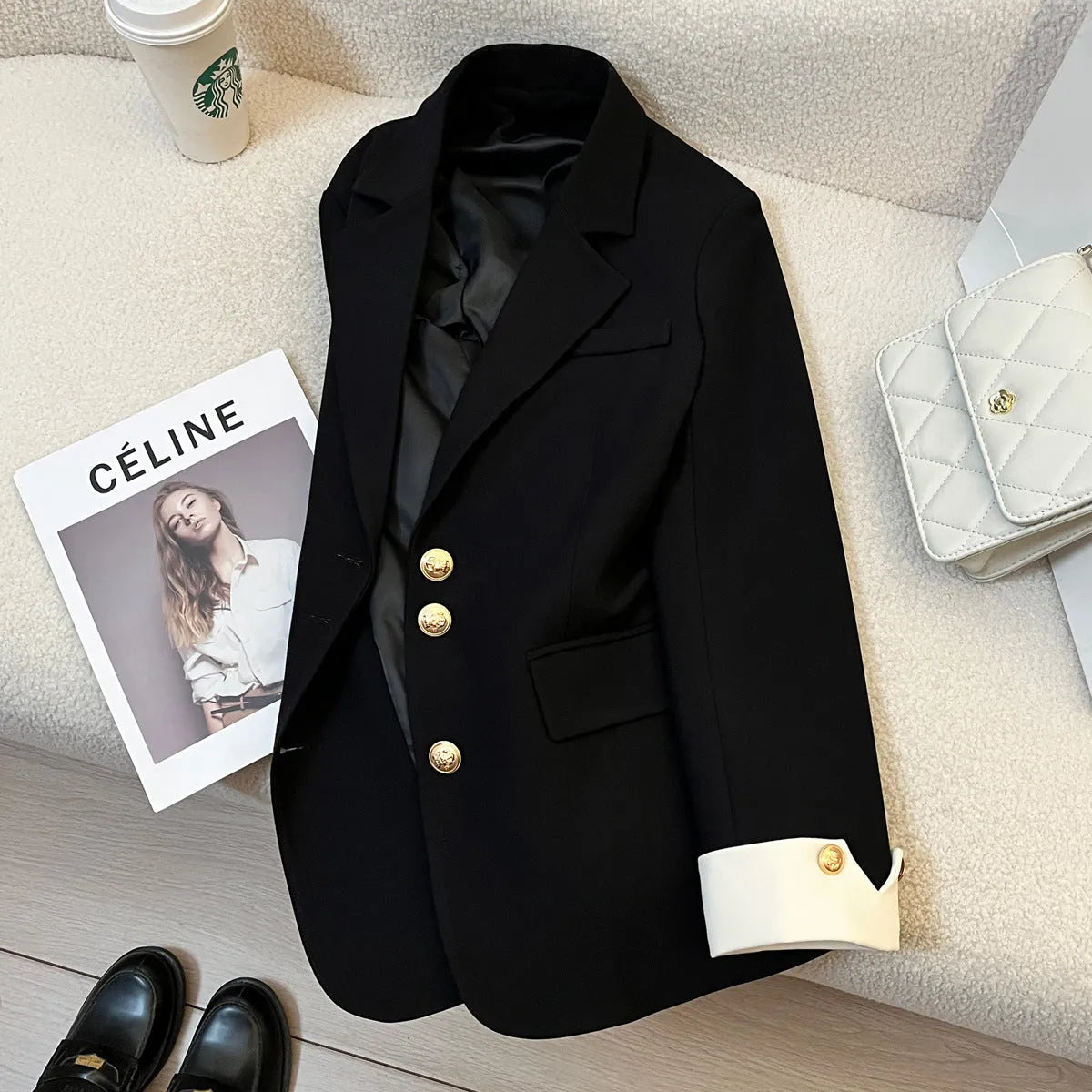 Milky white loose fit Korean-style women's coat with long sleeves and pockets.