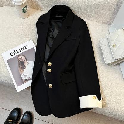 Milky white loose fit Korean-style women's coat with long sleeves and pockets.