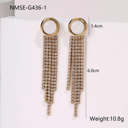 Gold-coloured women's earrings with a love heart shape, star details and dangling diamond-style tassels on a white background.