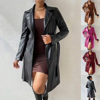 Women's long sleeve faux leather trench coat in various colors with pockets and slim fit design
