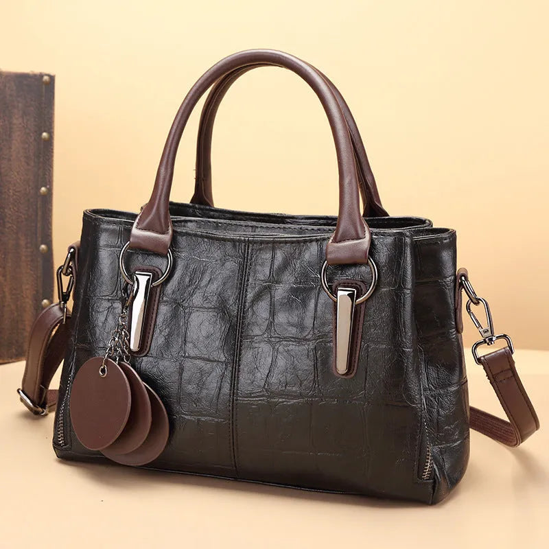 Retro contrast large capacity shoulder bag showing horizontal square shape and multiple internal compartments