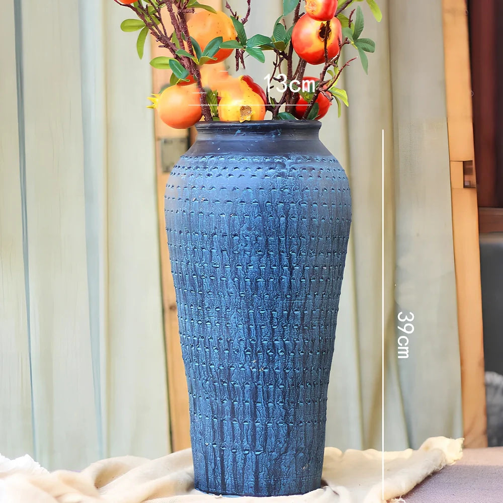 Ceramic mosaic vase with dried flowers, showing mosaic pattern and 25cm height
