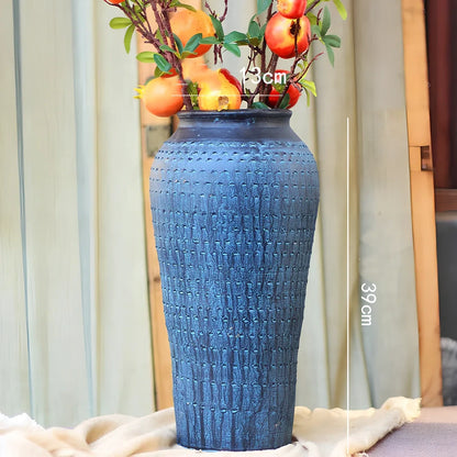 Ceramic mosaic vase with dried flowers, showing mosaic pattern and 25cm height