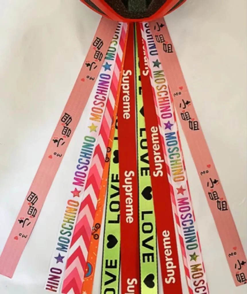 Children's helmet streamer with 60 cm polyester ribbon in colours like apricot and khaki for roller skating and skiing