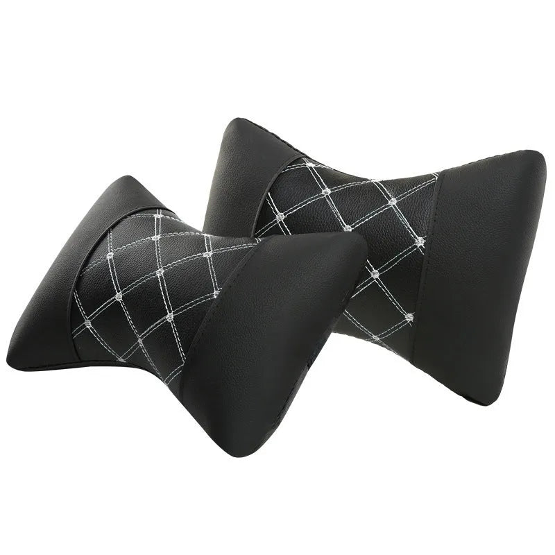 Leather quilted car headrest in black with blue lines, showing diamond check pattern and cervical neck support design.