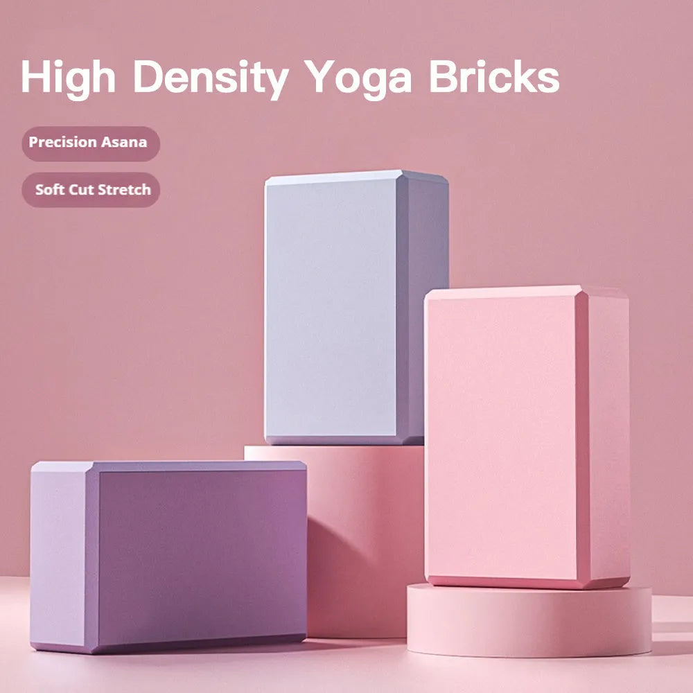 Blue EVA foam yoga block on a yoga mat, showing 23x15x7.6cm dimensions and textured surface for grip