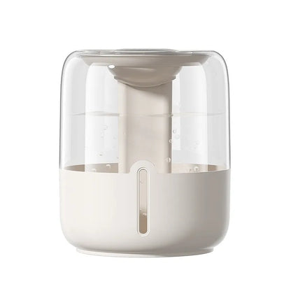 Beige round humidifier with dual spray nozzles, humidity display, and USB power connection