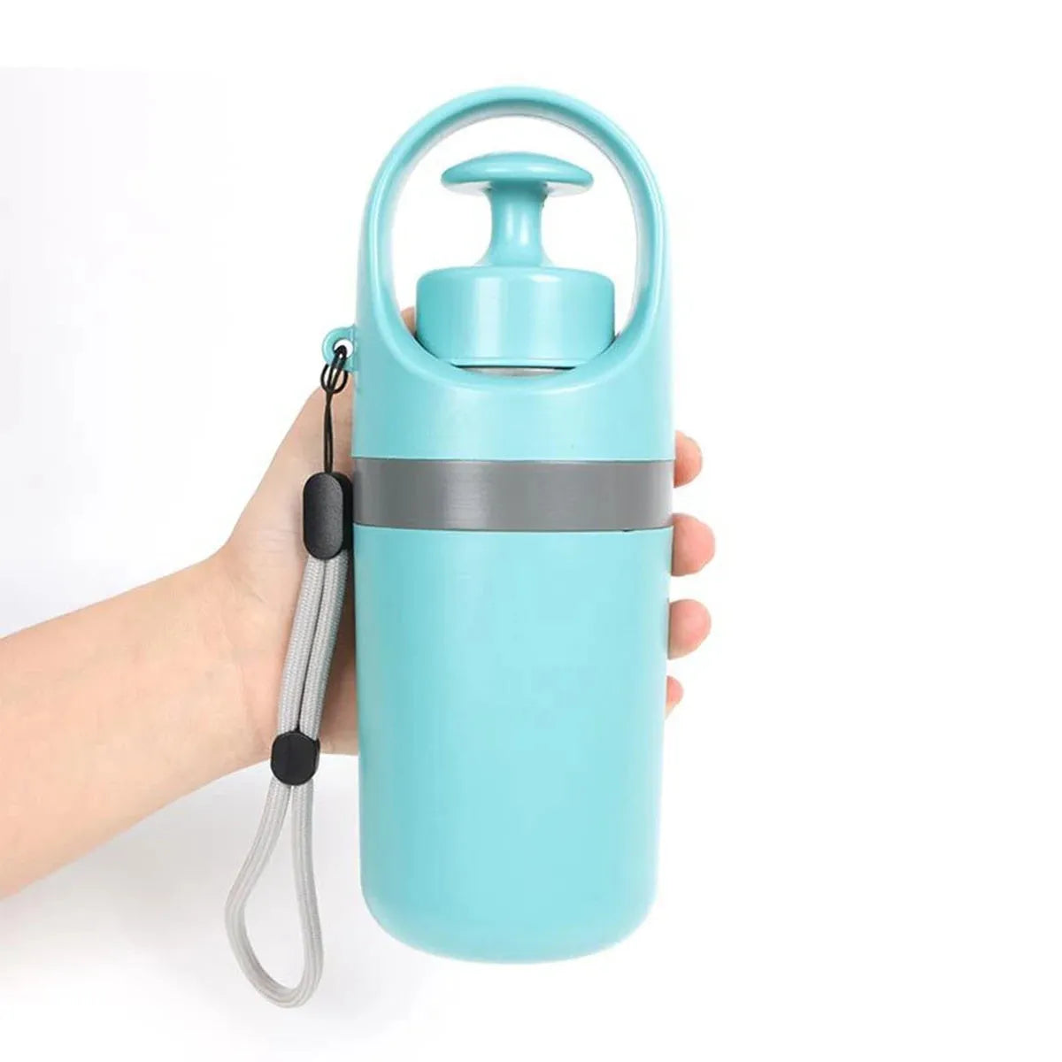 Blue portable claw-style dog pooper scooper with a roll of disposable bags for outdoor pet waste clean-up.