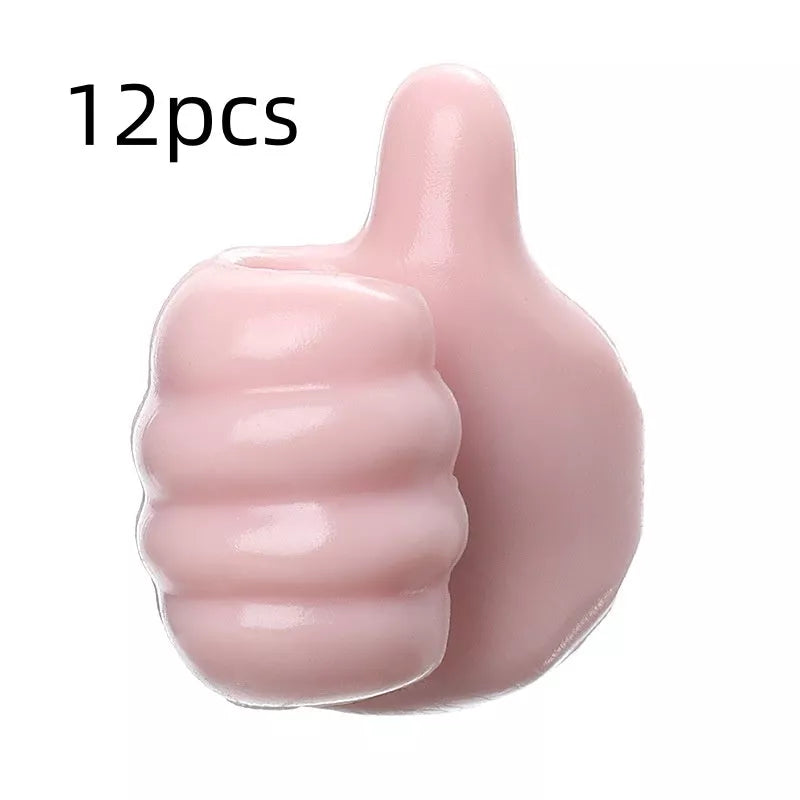 Silicone thumb wall hooks in various colors for organizing kitchen and bathroom items