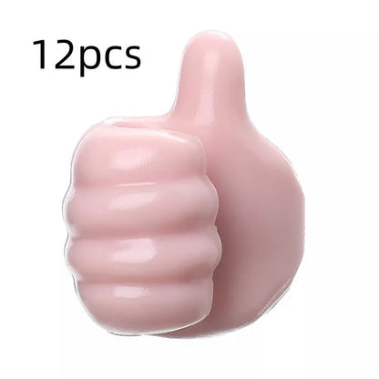 Silicone thumb wall hooks in various colors for organizing kitchen and bathroom items
