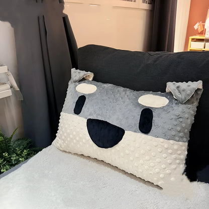 Grey schnauzer print dog pillow cushion on a sofa, measuring 50cm long.