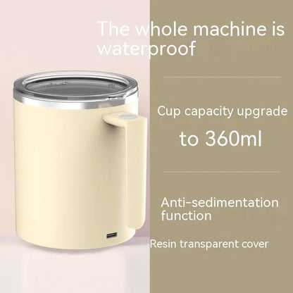 White automatic magnetic stirring coffee cup with stainless steel interior on a desk