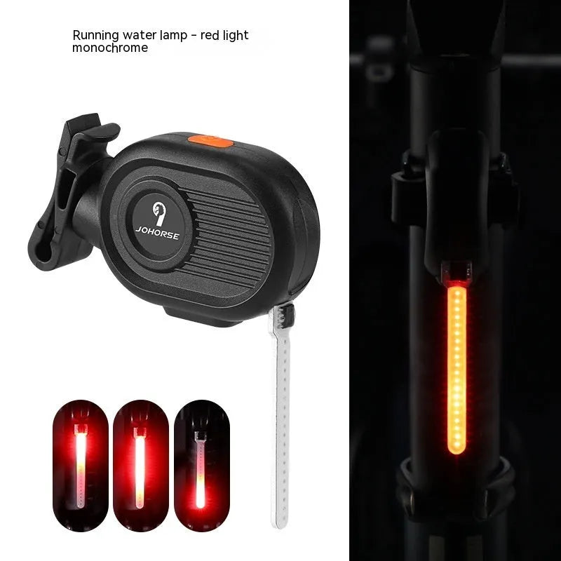 Bicycle rear safety light with a cascading waterfall LED light effect, mounted on a seat post.