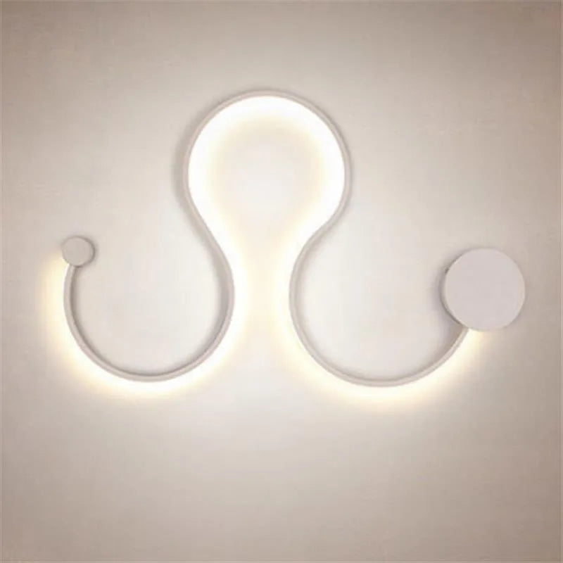 Modern black and white LED wall lamp with aluminium shade in four different sizes for bedside or corridor lighting