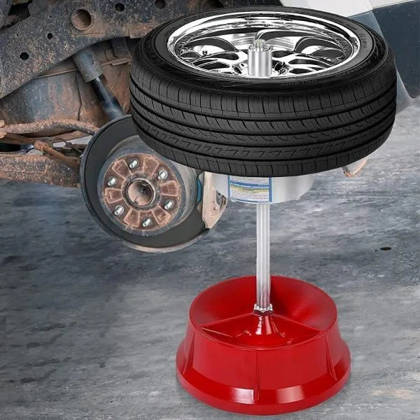 Portable hub balancer with aluminium head, bull's eye level, and 11.5" diameter base for wheel balancing