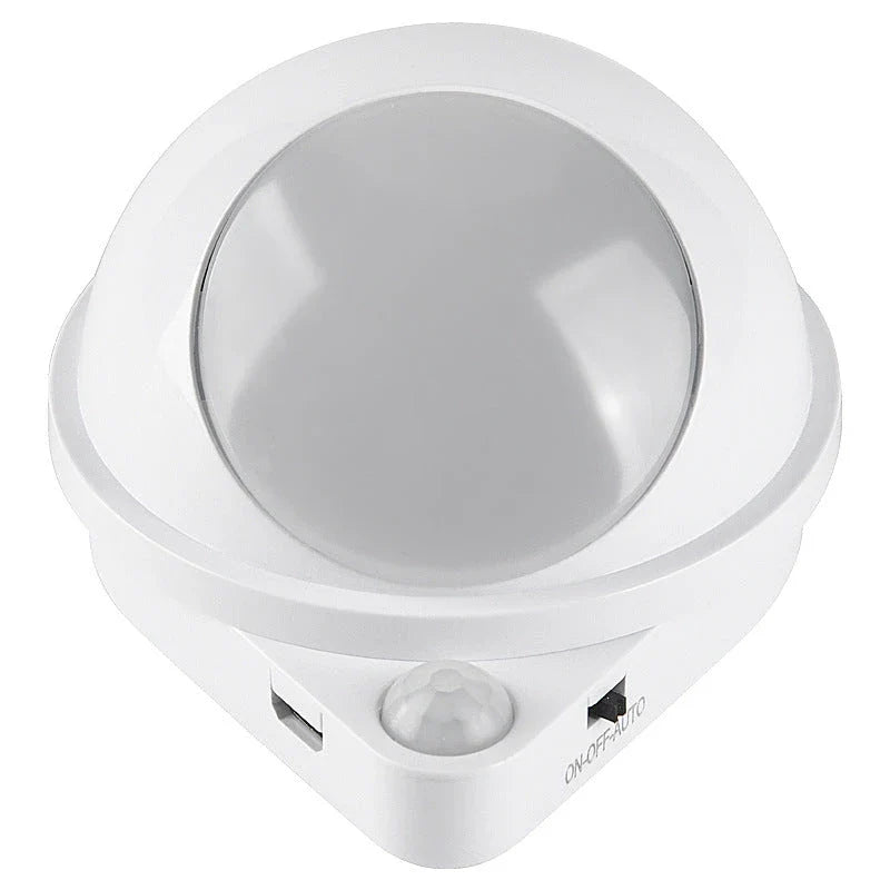 A versatile LED motion sensor night light with a 360-degree rotating head, perfect for illuminating any space in your home or office.