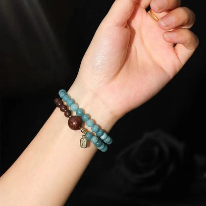 Natural stone blue women's beaded bracelet with geometric shapes and Chinese Fu and Xi characters.
