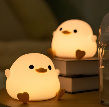 Seagull-shaped silicone night light in blue or yellow measuring 96.5×91×130mm with tap controls