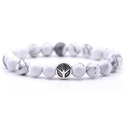 Handcrafted natural stone bracelet with alloy volcano white turquoise charm in a simple design.