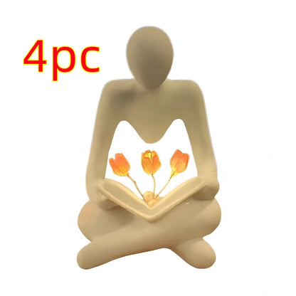 Nordic abstract thinker statue with tulip book night lamp measuring 7x6.3x11.5cm