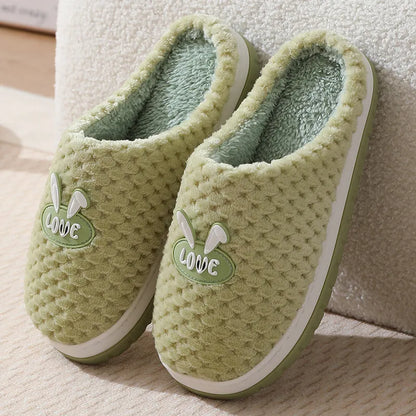 Women's plush rabbit plaid design winter slippers with a thick light-coloured rubber sole.