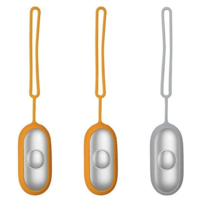 Hand-held micro-current sleep aid device in grey, green, and orange colour options