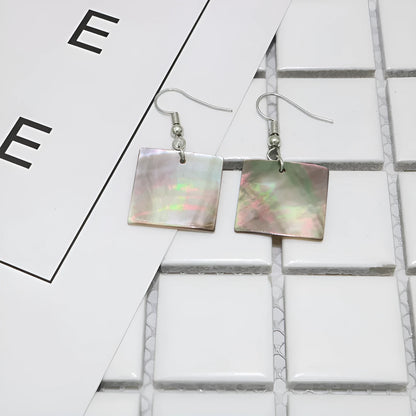 Natural shell earrings in geometric square and rectangular shapes with panther pattern detailing