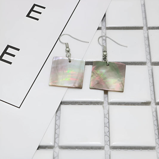 Natural shell earrings in geometric square and rectangular shapes with panther pattern detailing