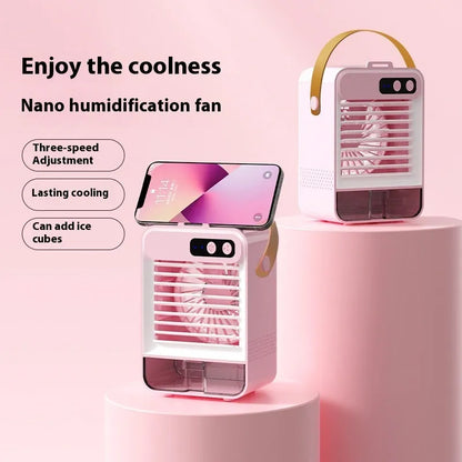 Dark green compact desktop air humidifier with USB port on a wooden desk.