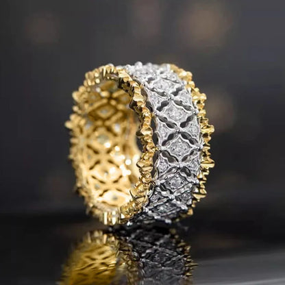 Geometric two-tone zircon ring with electroplated gold finish on copper, showing round elements and angular design