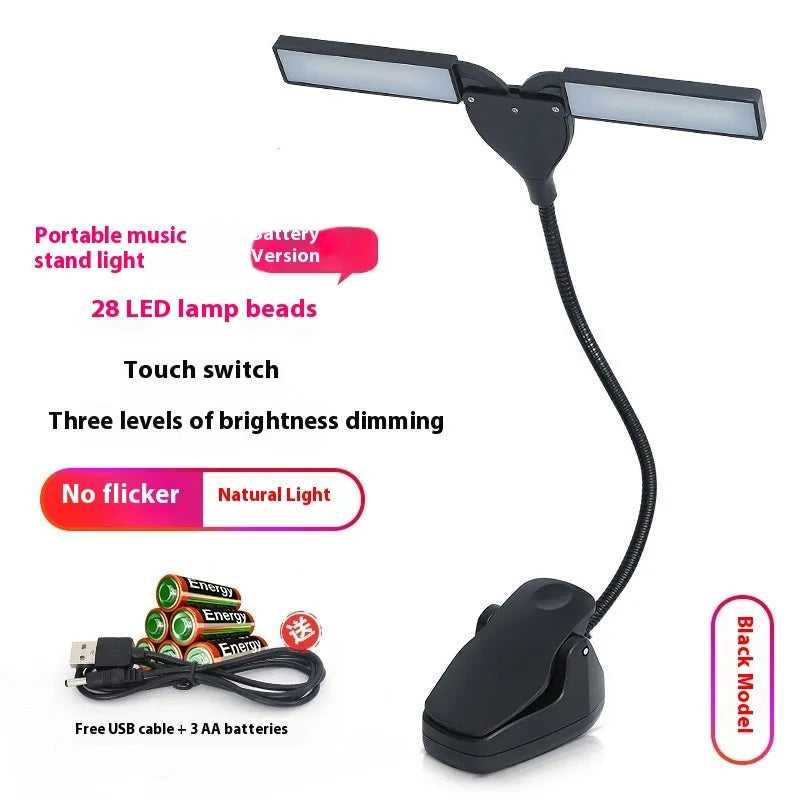 Black music stand light with flexible neck attached to metal music stand, illuminating sheet music