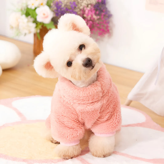 Blue double-sided plush four-legged dog clothing with high collar and towing ring laid flat.