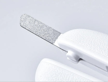 White pet nail clippers with LED light, anti-splash guard, and built-in nail file on a flat surface.