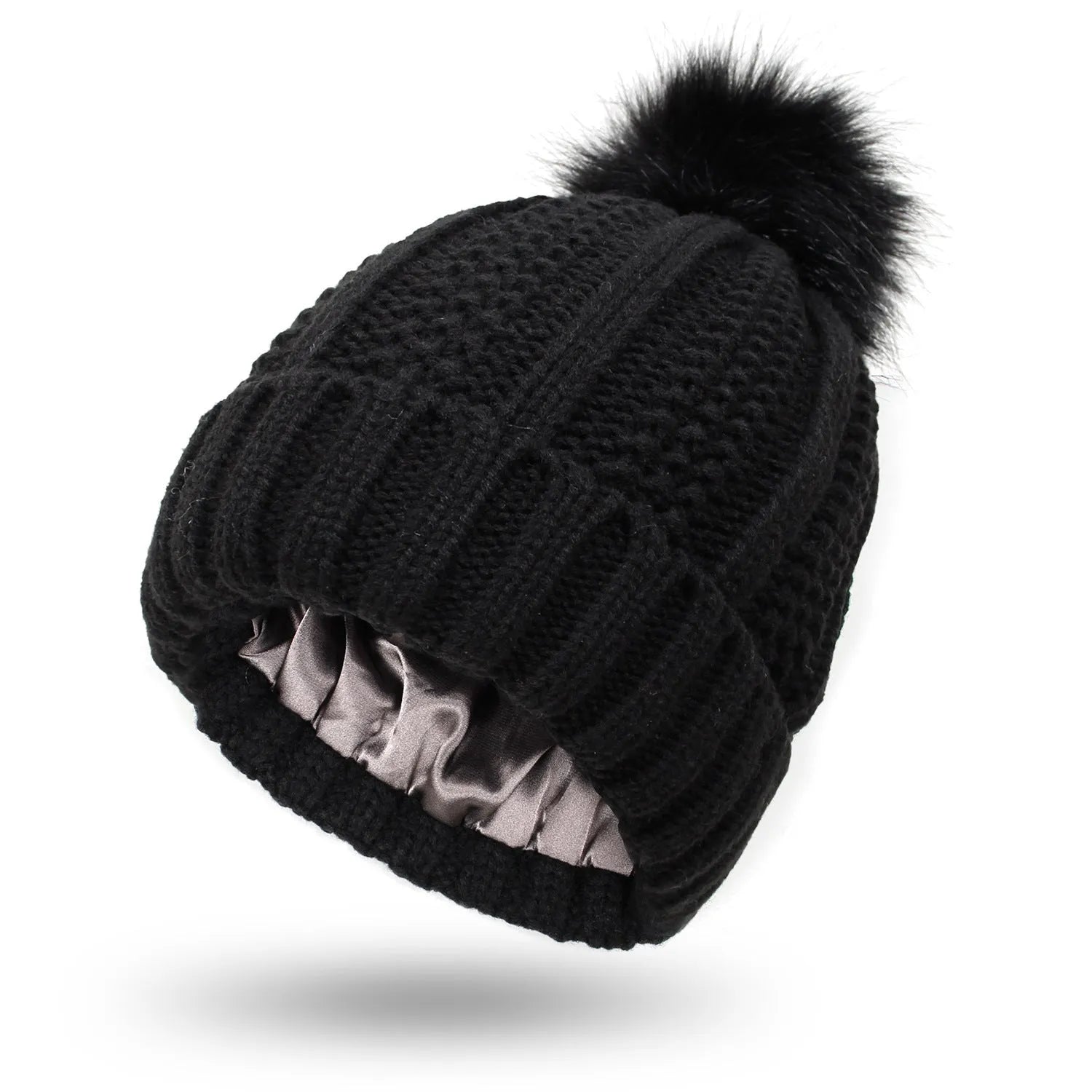 Wool knit beanie hat for women with faux fur pom pom and satin lining, shown in a wine red colour.