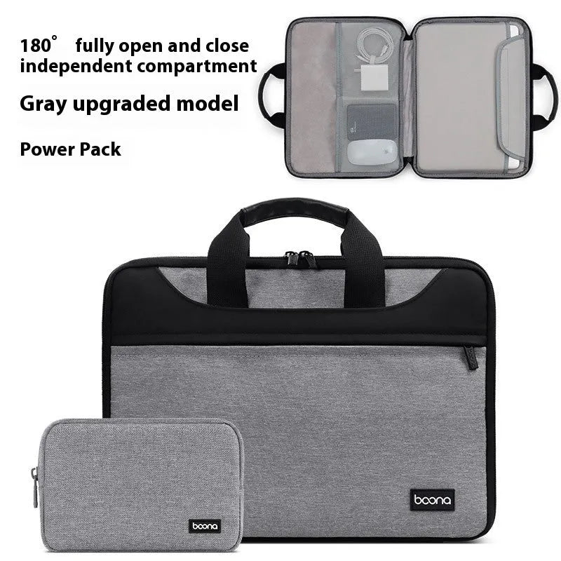 Black full zip opening Oxford cloth laptop bag for business travel with a soft carry handle.