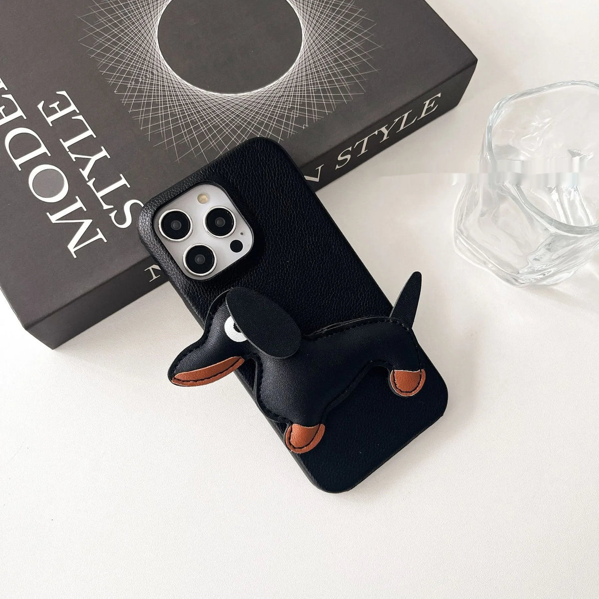 Leather sausage dog iPhone case with embossed 3D dachshund design in brown, all-inclusive anti-fall cover