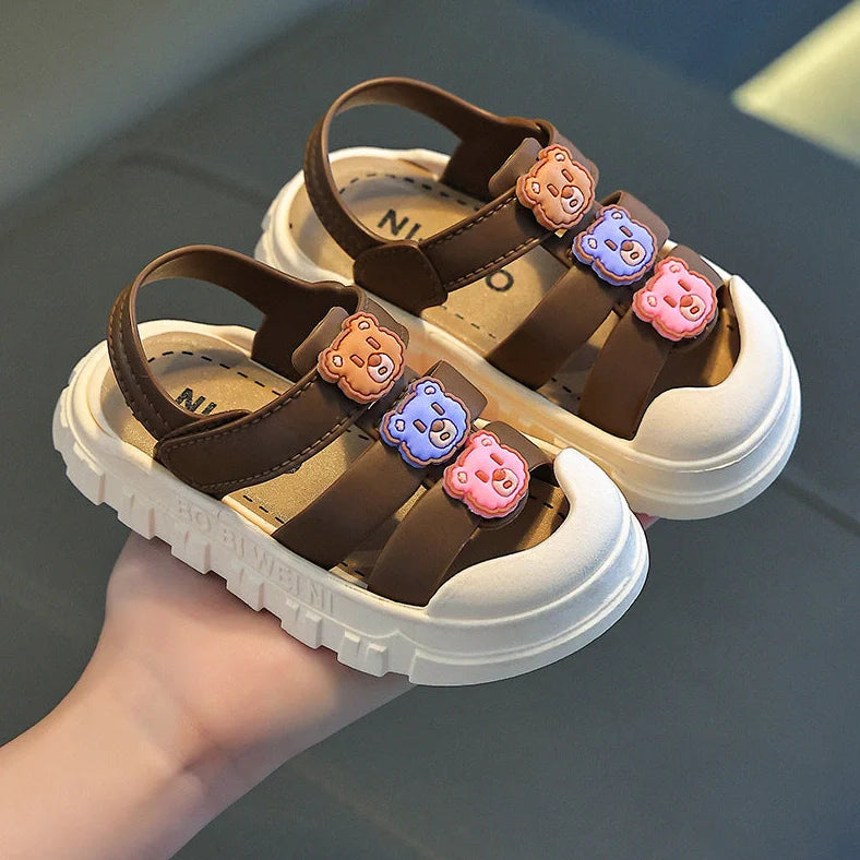 Boy's cartoon pattern baby shoes with non-slip PVC soles and Velcro fastening in black colour