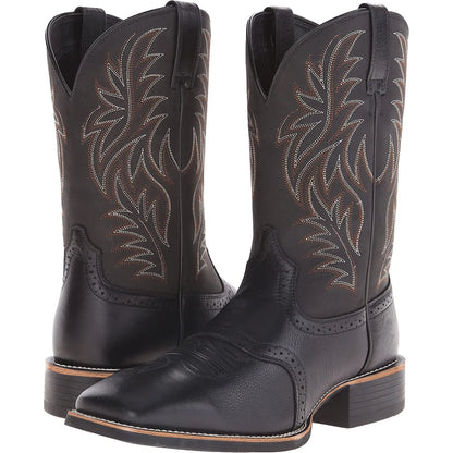 Black Western cowboy boot with vintage embroidery, square toe, and low heel on a rubber sole