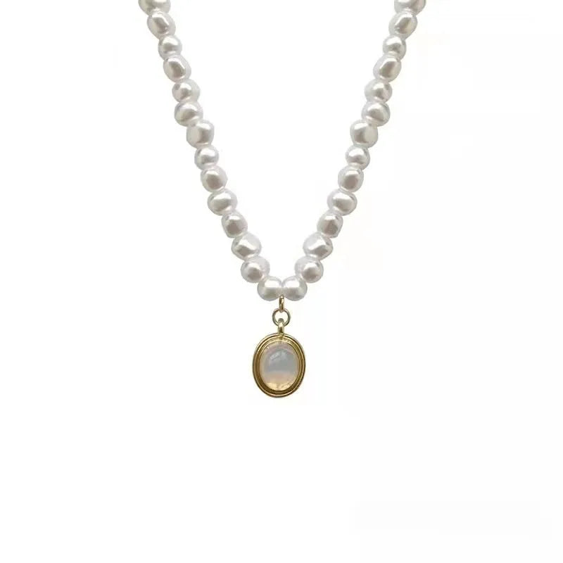 Adjustable French Court vintage pearl necklace with geometric design on alloy chain, showing length variation