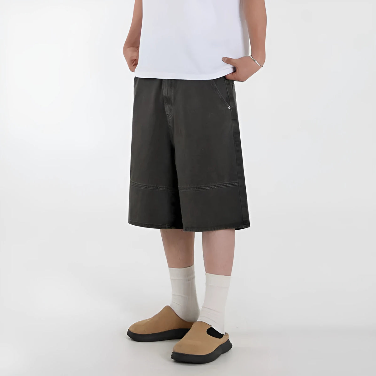 Men's grey loose fit denim shorts with mid waist and zip fly, cropped length, sizes M to 2XL